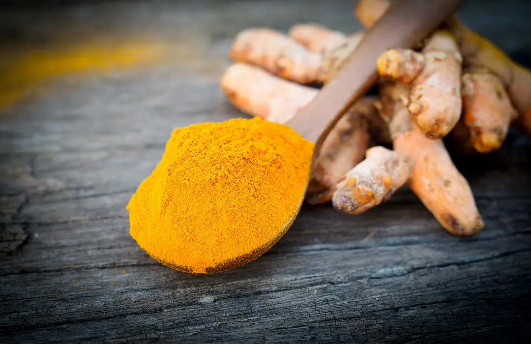 turmeric-powder-fresh-turmeric-wooden-spoon-old-wooden-table-herbs-are-native-southeast-asia.webp